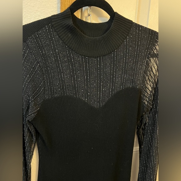 Dresses & Skirts - Worn once. Very flattering black stretchy dress with Sheer chest area.